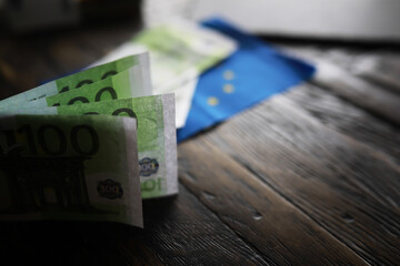 100 euro banknote pack and wood bankground. Currency, financial