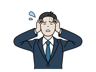 頭を抱えて困っている会社員の男性、ビジネスマン
