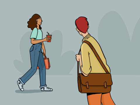Picture of woman walking on street near standing man