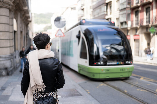 woman with tram behind