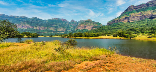 Panoramic view of beautiful Mulshi dam backwaters on a sunny day.