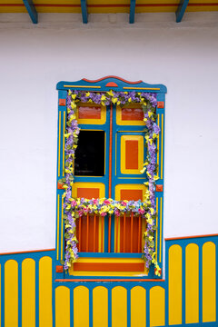 Traditional Colombian window full of colors and flowers