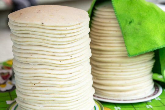 Tasty white corn arepas on plate