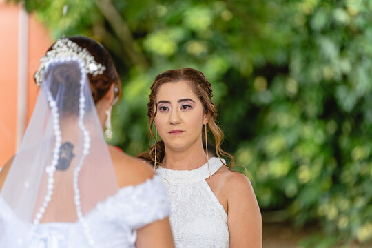 Gay female couple at their wedding. 
