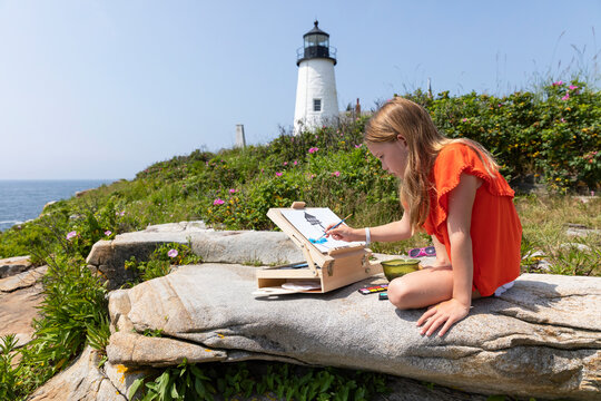 Young Girl artist at Lighthouse on Coast of Maine summer painting 