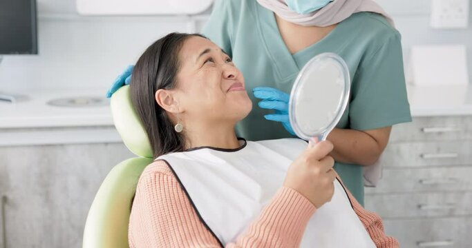 Dentist, woman patient and mirror for dental care, teeth and smile at consultation. Medical, healthcare and orthodontist in clinic, oral hygiene examination and happy female person at checkup
