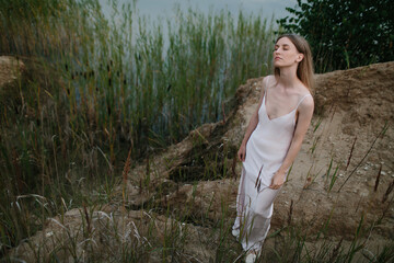 Calm woman portrait in dress outdoors
