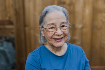 Potrait of elderly woman with warm, genuine smile.