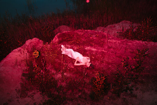 Enigmatic portrait of woman at night