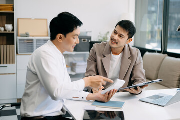 Portrait of success business people working together in office. Couple teamwork startup concept..