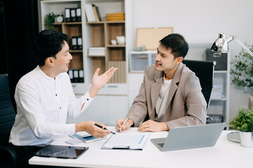 Fototapeta premium Portrait of success business people working together in office. Couple teamwork startup concept..