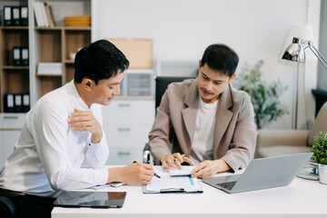 Obraz premium Portrait of success business people working together in office. Couple teamwork startup concept..