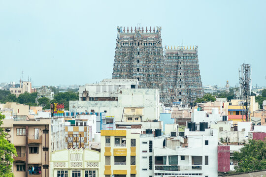 The iconic towers of the Madurai Meenakshi Temple, towering above the surrounding cityscape.