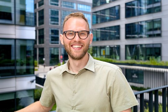 Portrait of a businessman man, smiling and looking at the camera