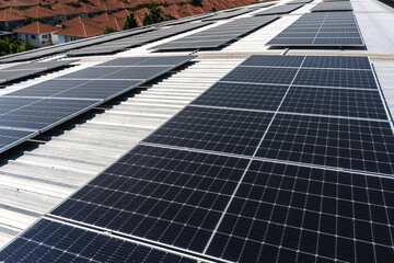 solar panels installing on factory building roof