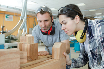 students in woodwork training course with professional