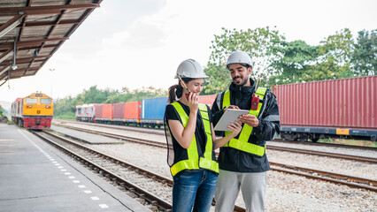 Team of engineer railway wearing safety uniform and helmet under checking train ,wheels and control system for safety transportation. Maintenance cycle concept.