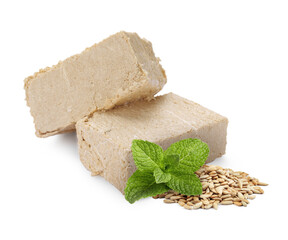 Tasty halva, peeled sunflower seeds and mint isolated on white