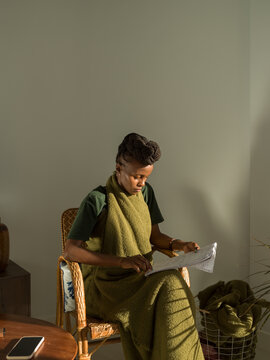 Concentrated female student learning in light room