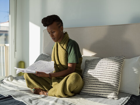 Black woman self studying at home during weekend