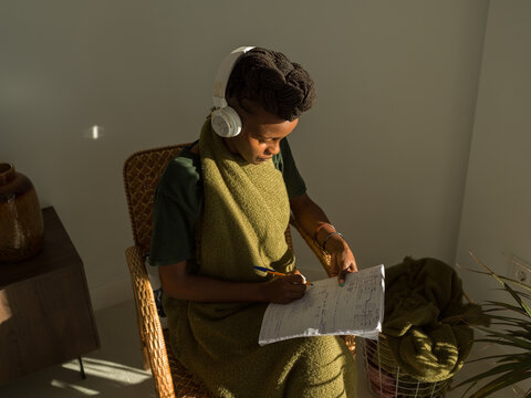 Focused female student doing audio test