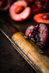 Freshly harvested ripe cherries on the dark rustic background. Selective focus. Shallow depth of field.