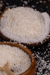 Fototapeta na wymiar white coconut pulp and dried coconut flakes
