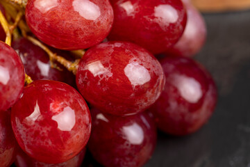 large red wet grapes in drops of water - 751251285