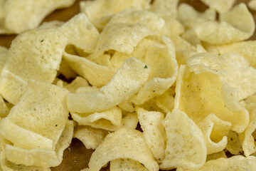crispy potato chips with spices on the table