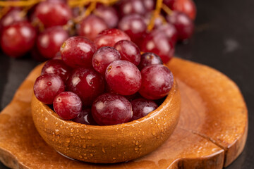 large red wet grapes in drops of water - 751252828
