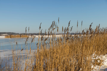 frozen lake covered with snow and ice in winter - 751252832