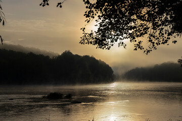 Small fog on the river in autumn