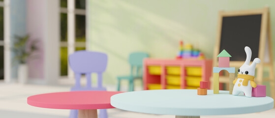 A presentation space and kid toys on a round table in a colorful kid's playroom or classroom.