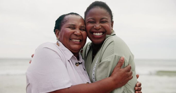 Happy, mother and daughter hug at beach with love and happiness on holiday or vacation together. African, family and portrait of mature mom in embrace with woman at ocean with kindness and support