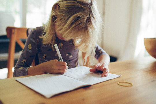 A girl doing homework at home