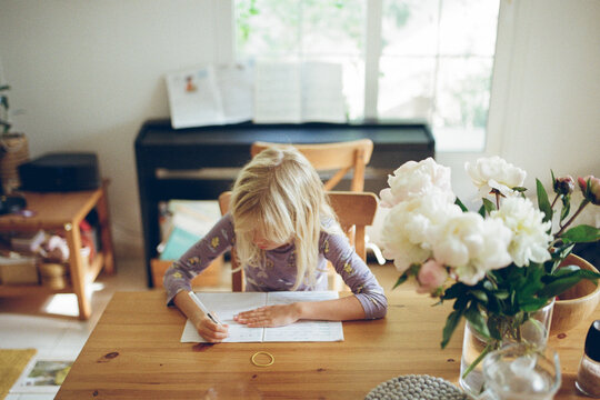 A girl doing homework at home