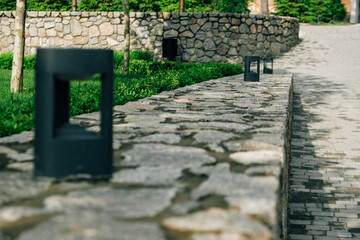 Decorative floor lamps on a stone wall. Selective focus.