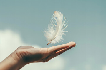Gentle Embrace of the Sky: Feather Floating on Open Hand Banner - obrazy, fototapety, plakaty