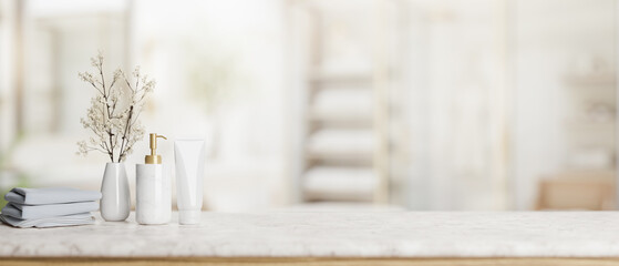 Copy space on a luxury white marble tabletop with toiletries in a modern bright and clean bathroom.