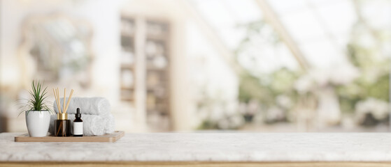 Toiletries and a presentation space on a white marble tabletop in a contemporary bathroom.