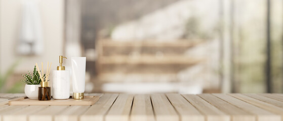 A spa set on a wooden tabletop with a blurred background of a contemporary, spacious bathroom.