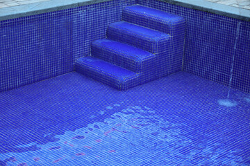 sulphurous, Swimming pool steps with clear water surface background, nobody. Abstract pool texture, underwater pattern blue background with grid tiles, no people. Overhead view. Summer backdrop.