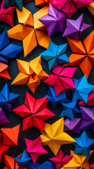 An array of colorful origami stars, their vibrant hues standing out against a stark, black background. mobile phone wallpaper