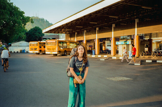 Woman backpacker on bus station