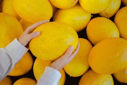 Woman holding melon 