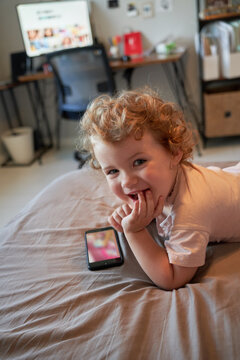 Cute Toddler Using Smartphone At Home
