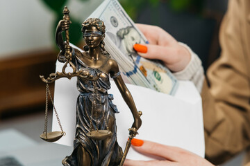 A woman lawyer receives money in an envelope. The concept of payment for legal services, corruption...