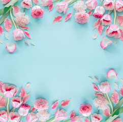 beautiful pink spring flowers on blue background