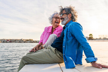 Beautiful happy senior couple bonding outdoors - Cheerful old people romantic dating in the city,...