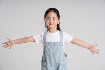 Portrait of a lovely Asian baby girl posing on a white background